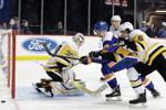 Islanders beat Penguins 4-3 in OT, point streak at 16