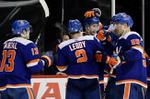 Islanders beat Penguins 4-3 in OT, point streak at 16